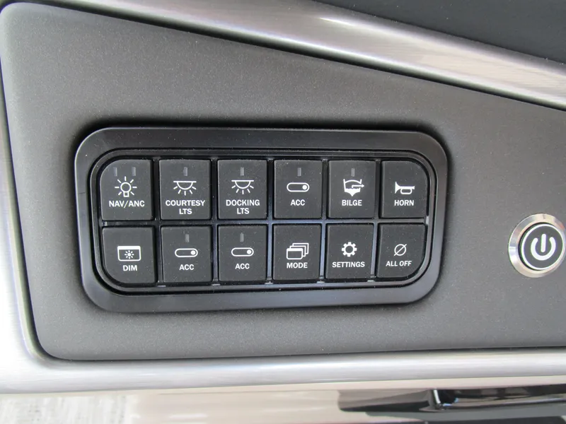 Slide: The Image of Control panel of 2024 Ranger Reata 223C boat with various function buttons. - 24