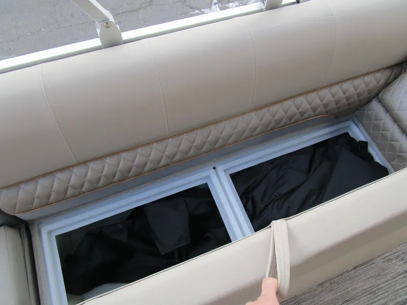 Slide: The Image of 2024 Ranger Reata 223C boat seat storage compartment with quilted upholstery. - 27