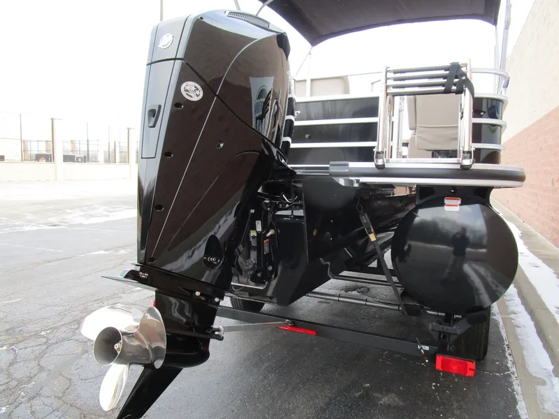 Slide: The Image of 2024 Ranger Reata 223C boat with powerful outboard motor, rear view. - 6