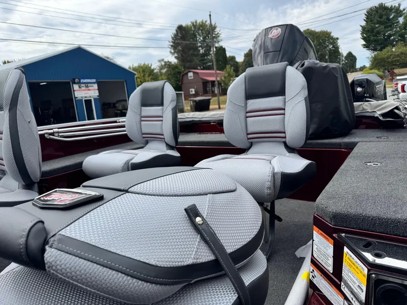 Slide: The Image of 2025 Ranger 620FS boat interior with gray seating, outdoor setting. - 9