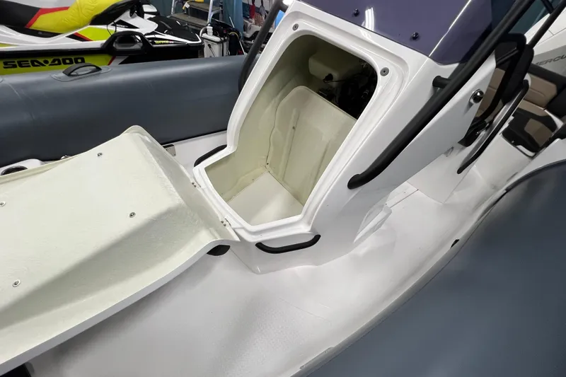 Slide: The Image of Open storage compartment in 2025 Grand G680 boat interior. - 5