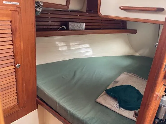 Slide: The Image of Cozy cabin interior of a 1997 Pacific Seacraft 40 sailboat with wooden accents. - 18