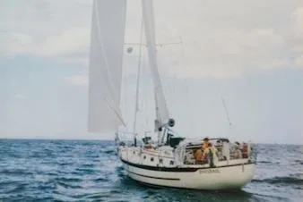 Slide: The Image of Sailing yacht Pacific Seacraft 40, 1997 model, cruising on open sea under clear skies. - 2