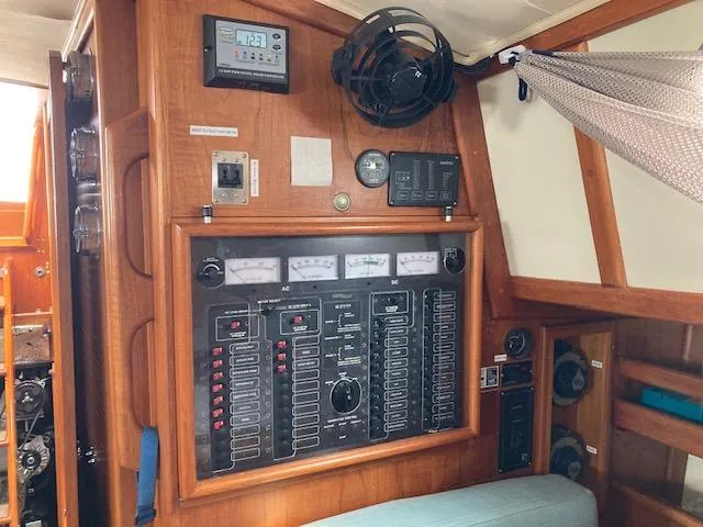 Slide: The Image of Electrical control panel inside a 1997 Pacific Seacraft 40 sailboat cabin. - 27