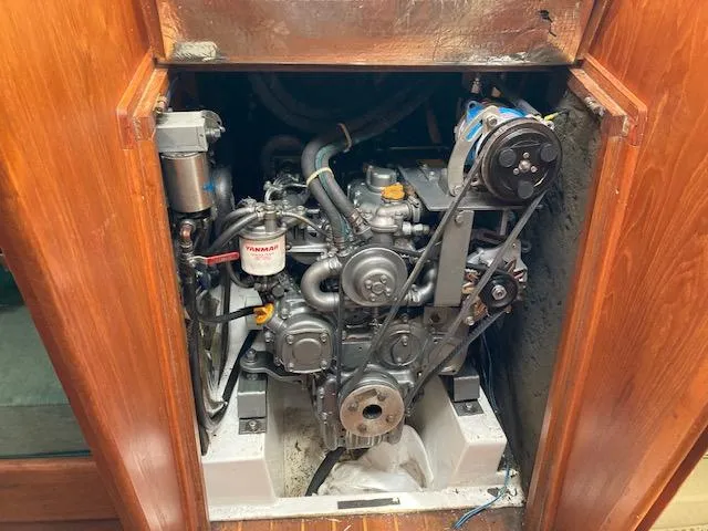 Slide: The Image of Engine compartment of a 1997 Pacific Seacraft 40 sailboat, featuring a Yanmar engine. - 31