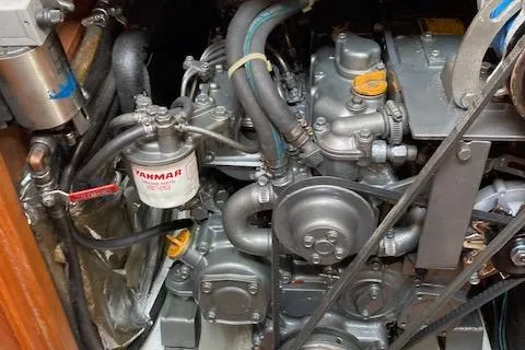 Slide: The Image of Engine compartment of a 1997 Pacific Seacraft 40 sailboat, featuring a Yanmar engine. - 32