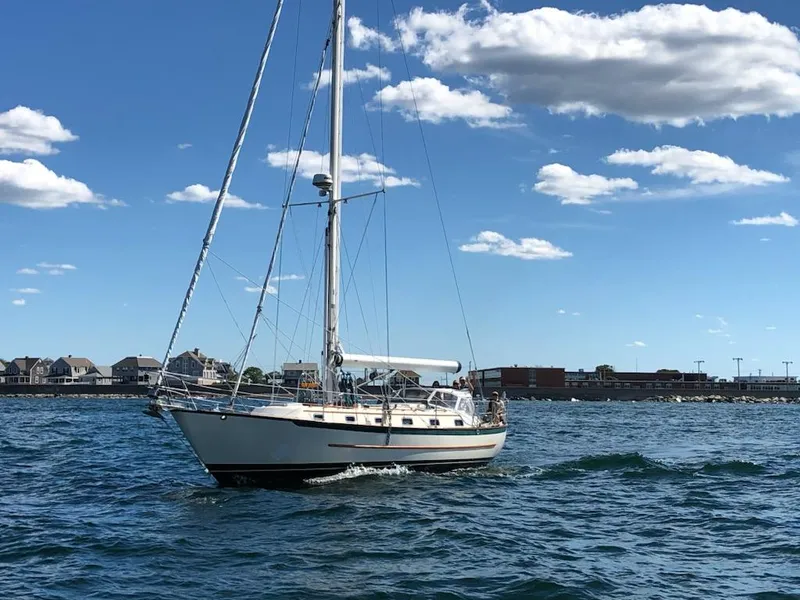 Slide: The Image of Sailing yacht Pacific Seacraft 40, 1997 model, cruising on a sunny day with clear skies. - 5