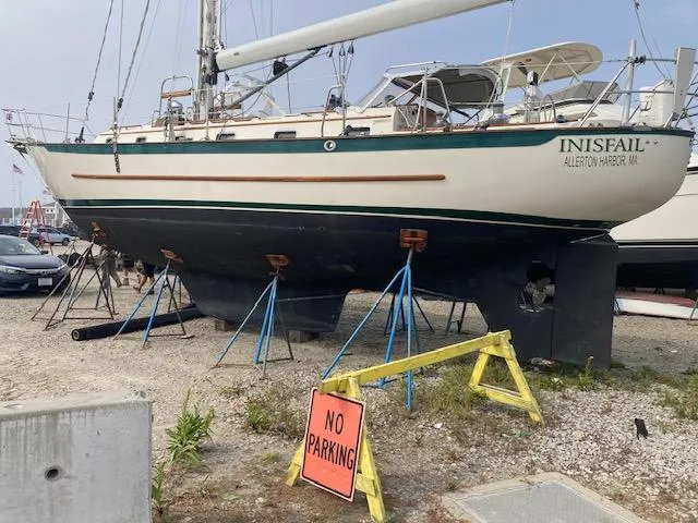Slide: The Image of 1997 Pacific Seacraft 40 sailboat on stands, "No Parking" sign in foreground. - 6