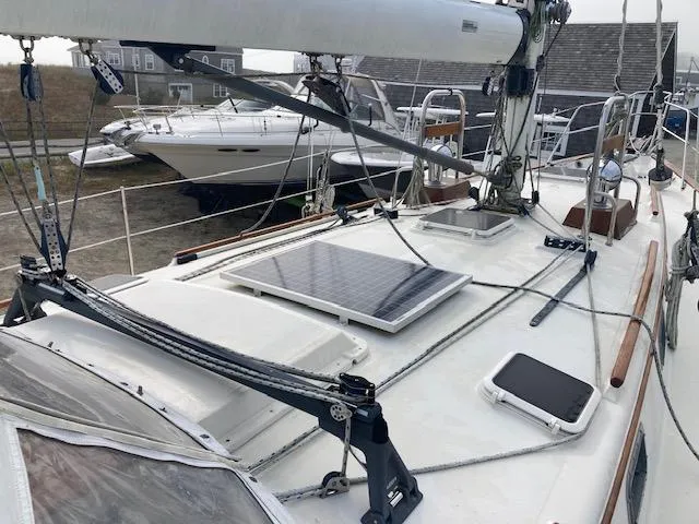 Slide: The Image of 1997 Pacific Seacraft 40 sailboat deck with solar panel and rigging. - 8