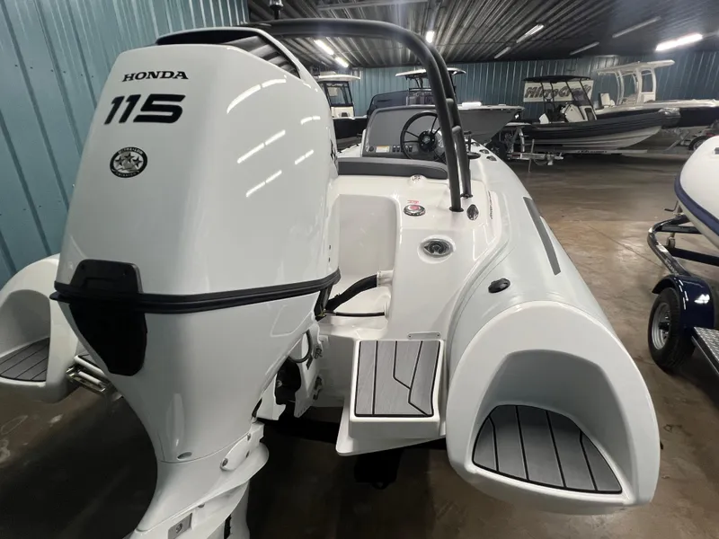 Slide: The Image of 2025 Grand G500HLF boat with Honda 115 outboard engine in a showroom. - 8