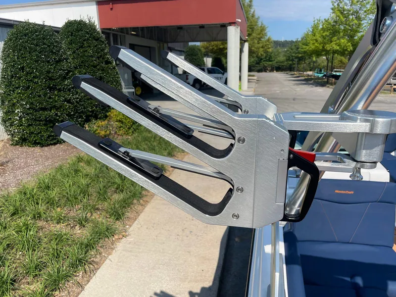 Slide: The Image of Wakeboard rack on 2021 MasterCraft NXT 24 boat, parked outdoors. - 13