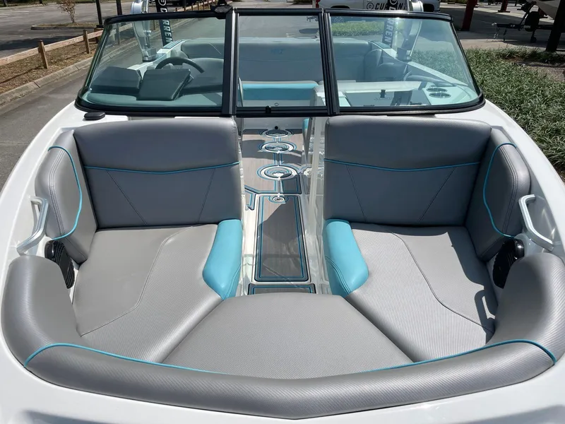 Slide: The Image of 2018 MasterCraft NXT20 boat interior with gray and blue seating. - 12
