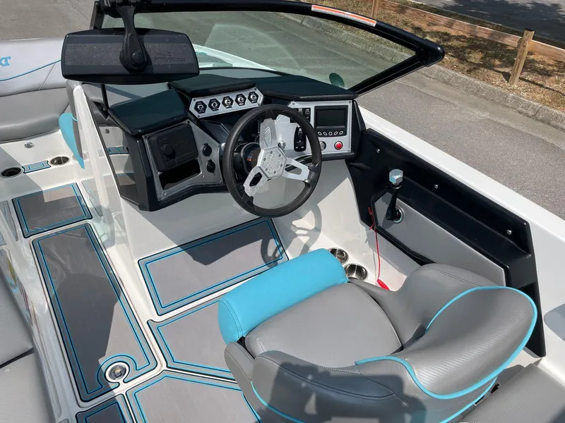 Slide: The Image of 2018 MasterCraft NXT20 boat interior with modern dashboard and steering wheel. - 13