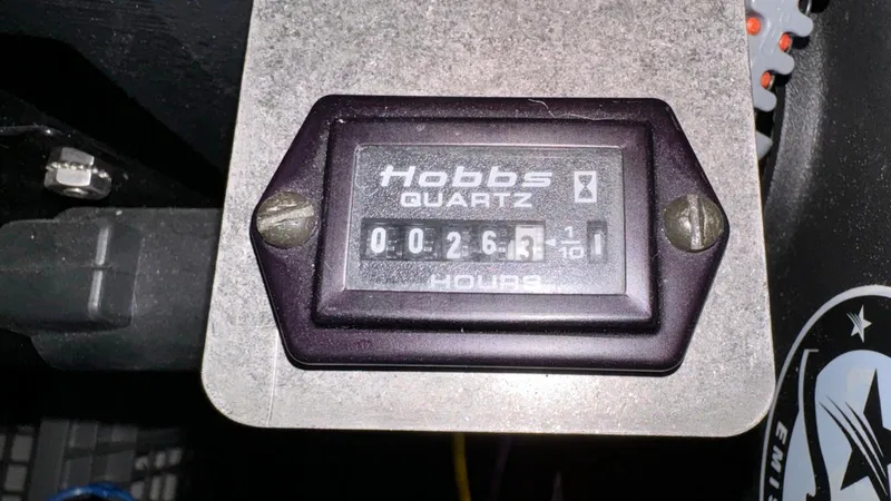 Slide: The Image of Hobbs Quartz hour meter reading 26.3 hours on 2006 Chris-Craft Speedster. - 11