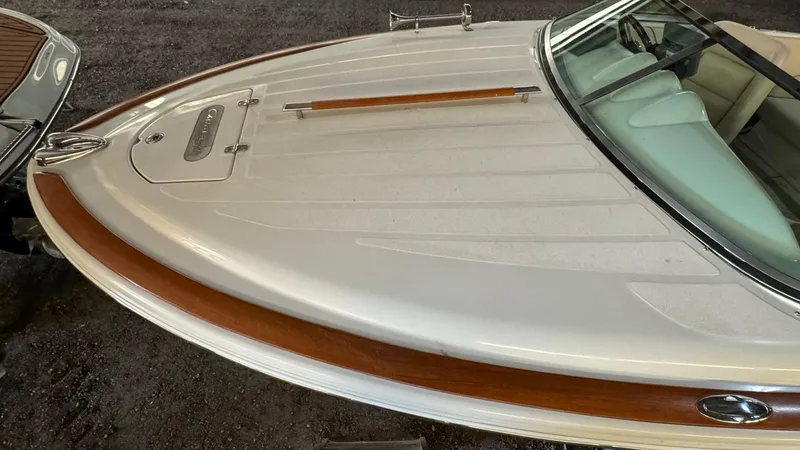 Slide: The Image of 2006 Chris-Craft Speedster boat with sleek design and wooden accents. - 3