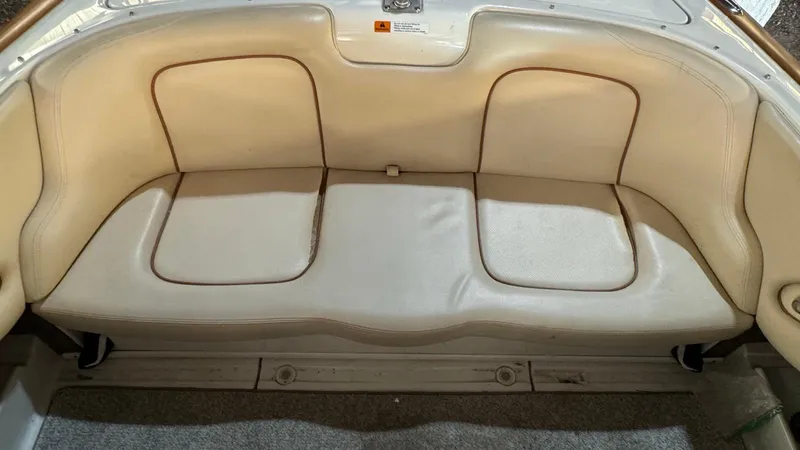 Slide: The Image of 2006 Chris-Craft Speedster boat interior with beige leather seating. - 8