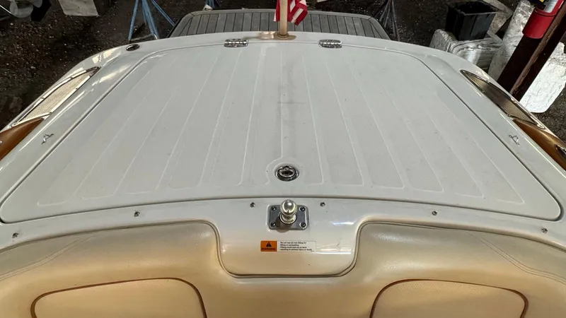 Slide: The Image of 2006 Chris-Craft Speedster boat deck with American flag in storage. - 9