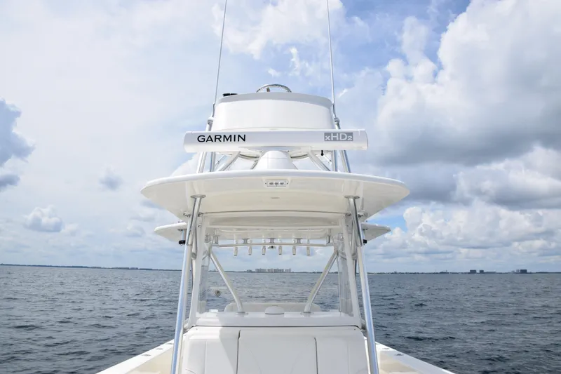 Slide: The Image of 2020 SeaVee 370z boat with Garmin radar on open water under cloudy sky. - 15
