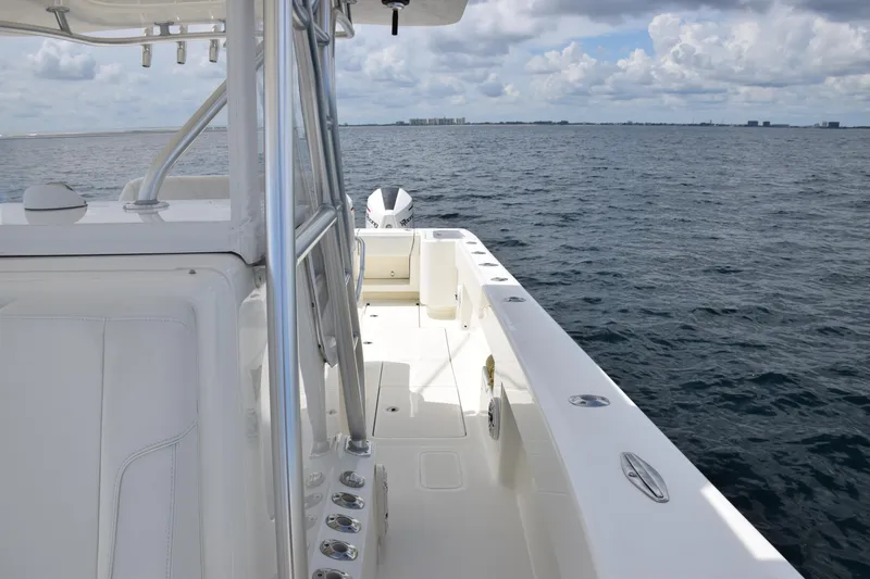 Slide: The Image of 2020 SeaVee 370z boat on open water under cloudy sky. - 17