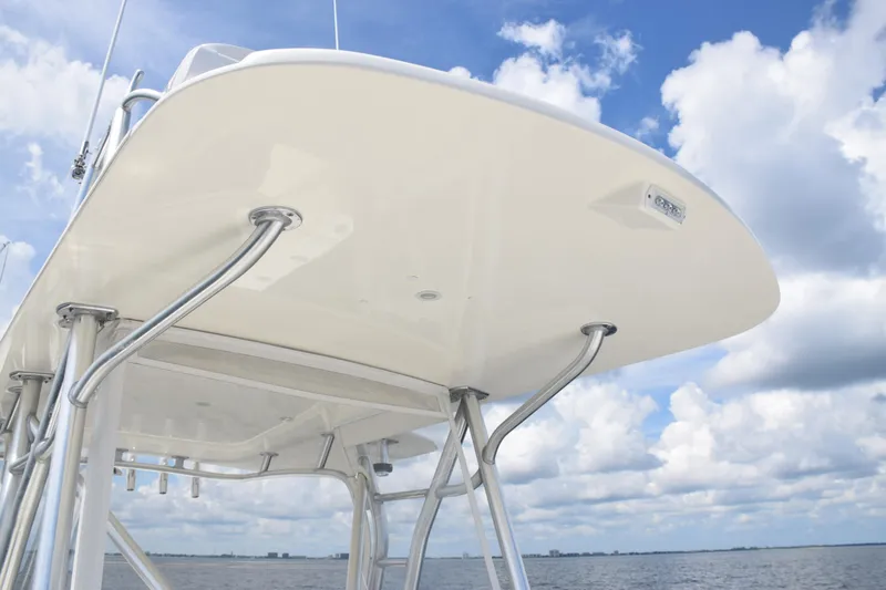 Slide: The Image of 2020 SeaVee 370z boat with T-top against blue sky and clouds. - 18