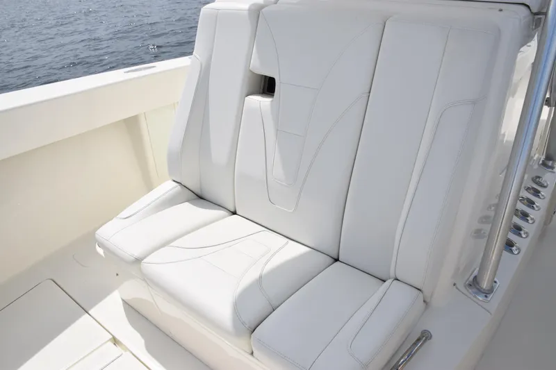 Slide: The Image of White leather seating on 2020 SeaVee 370z boat, near water. - 19