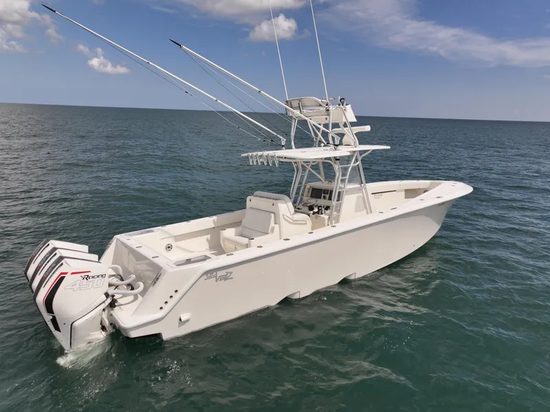 Slide: The Image of 2020 SeaVee 370z boat cruising on open water under cloudy skies. - 2