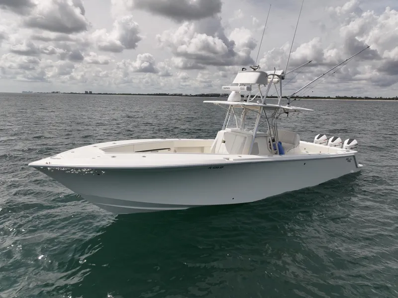 Slide: The Image of 2020 SeaVee 370z boat cruising on open water under cloudy sky. - 3