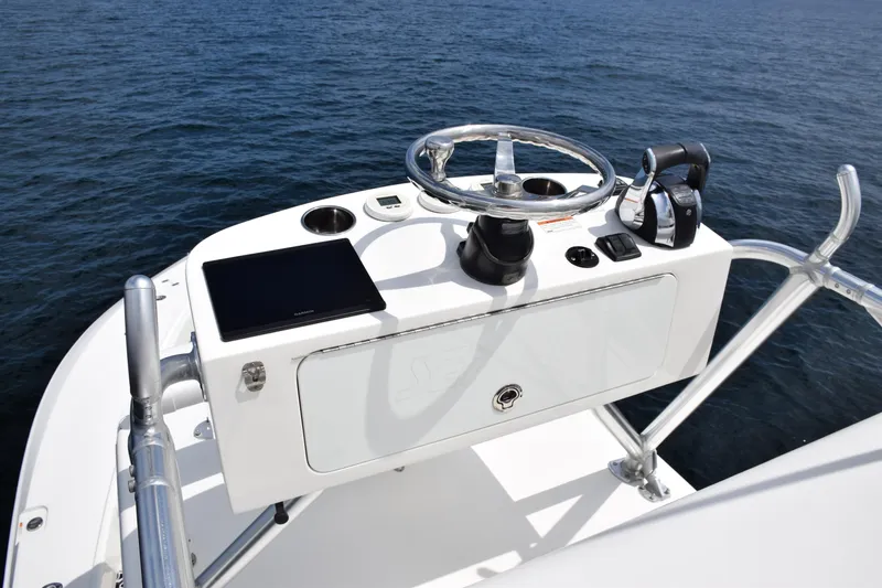 Slide: The Image of 2020 SeaVee 370z boat helm with steering wheel and controls on open water. - 35