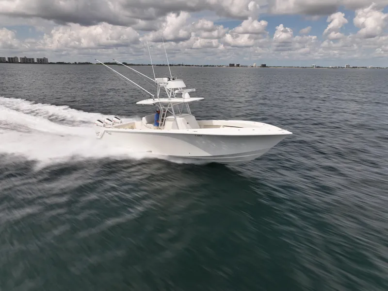 Slide: The Image of 2020 SeaVee 370z boat on open water under cloudy sky. - 5