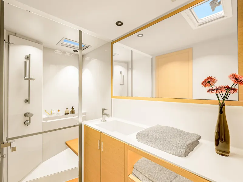 Slide: The Image of Luxurious bathroom interior of 2025 Hanse 590 yacht with modern fixtures and elegant decor. - 13