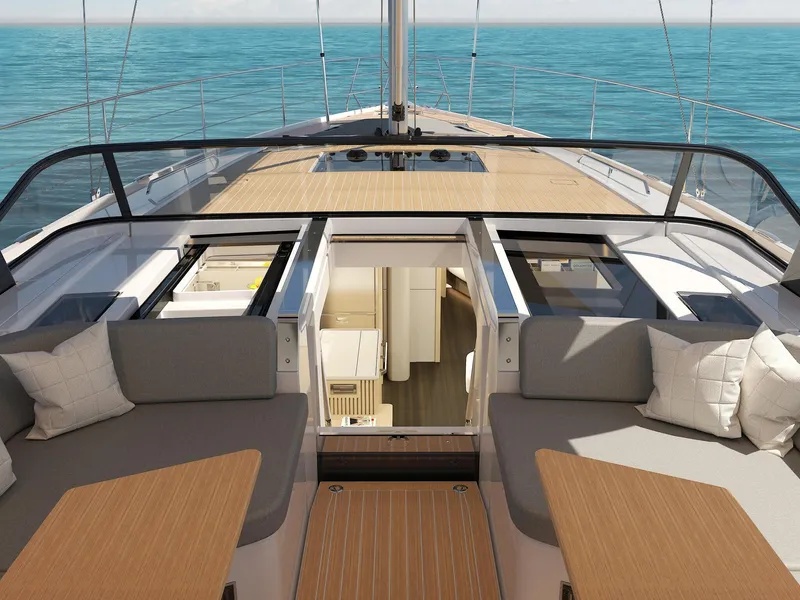 Slide: The Image of 2025 Hanse 590 yacht deck with seating, open hatch, and ocean view. - 6