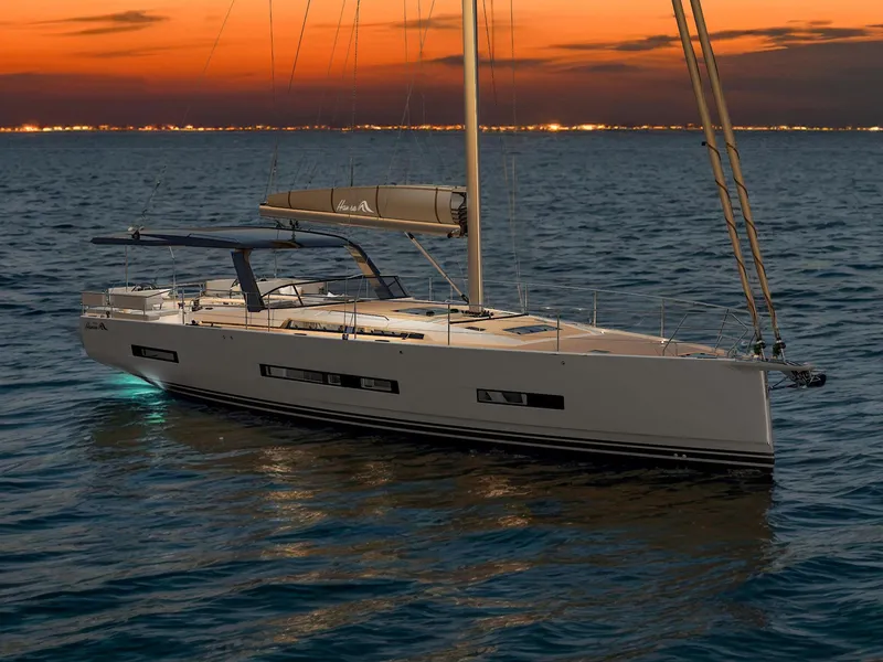 Slide: The Image of Sleek 2025 Hanse 590 yacht sailing at sunset on calm waters. - 8