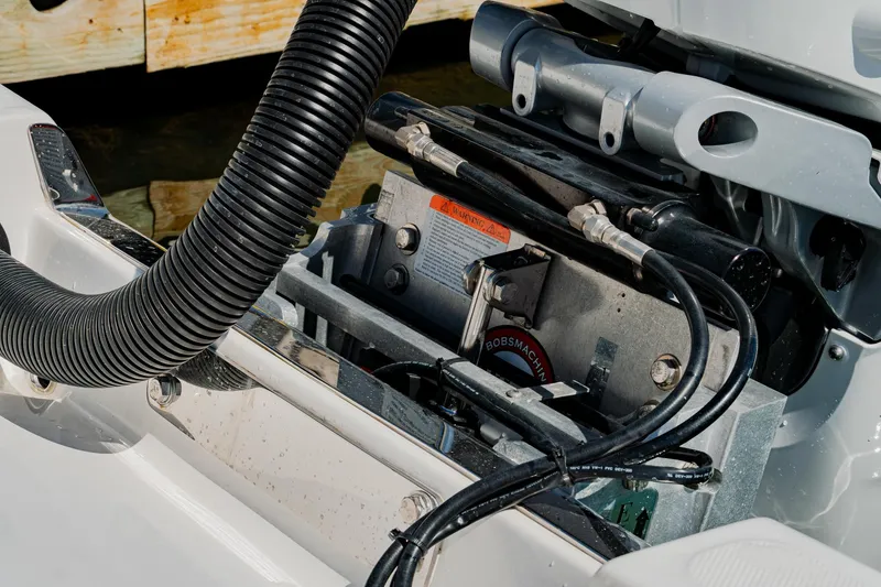 Slide: The Image of Engine compartment of a 2024 Blackwater 23 Hybrid boat, showcasing mechanical components and wiring. - 13