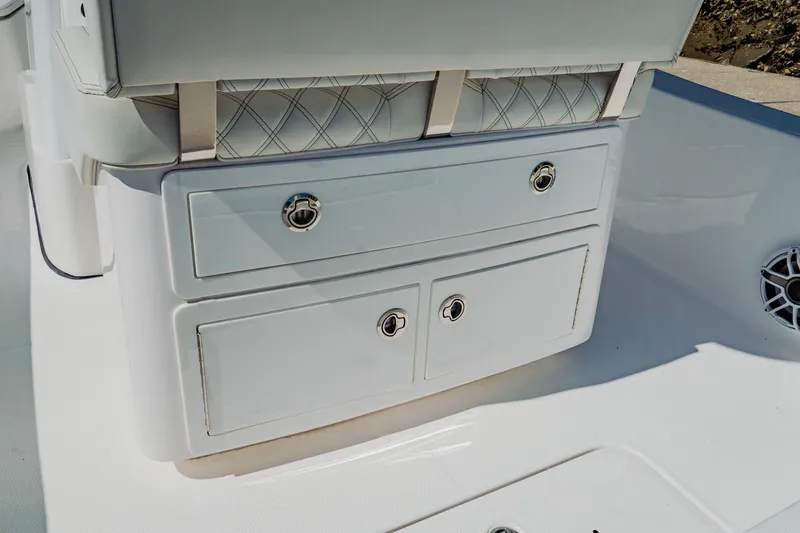 Slide: The Image of 2024 Blackwater 23 Hybrid boat storage compartment with sleek white finish and chrome handles. - 15