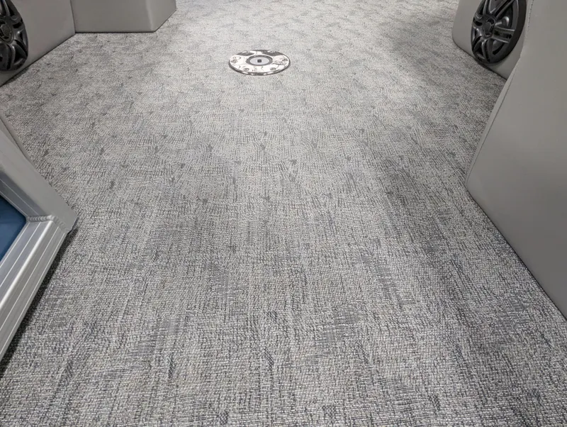 Slide: The Image of 2025 Trifecta 22UL LE T pontoon boat underside view in showroom. - 14