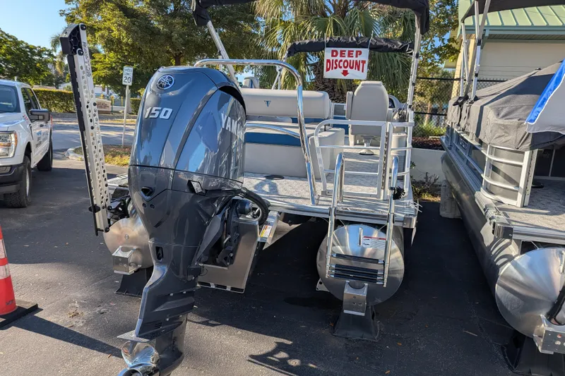 Slide: The Image of 2025 Trifecta 22UL LE T pontoon boat interior with seating and table. - 17