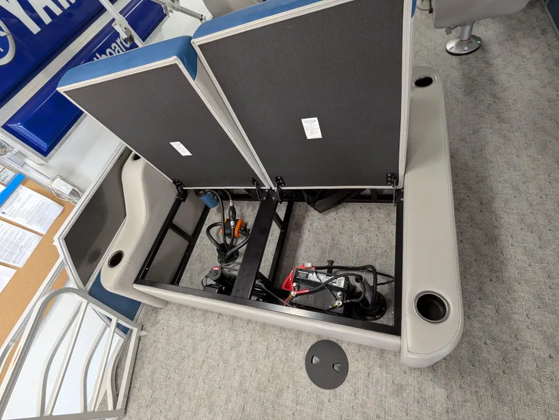 Slide: The Image of 2025 Trifecta 22UL LE T boat interior with cup holders and storage compartment. - 19