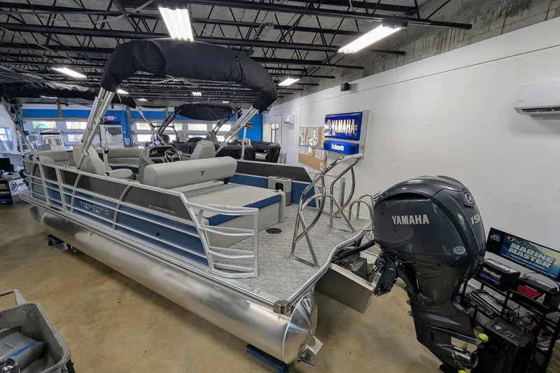 Slide: The Image of 2025 Trifecta 22UL LE T pontoon boat with Yamaha 150 engine, displayed for sale. - 2
