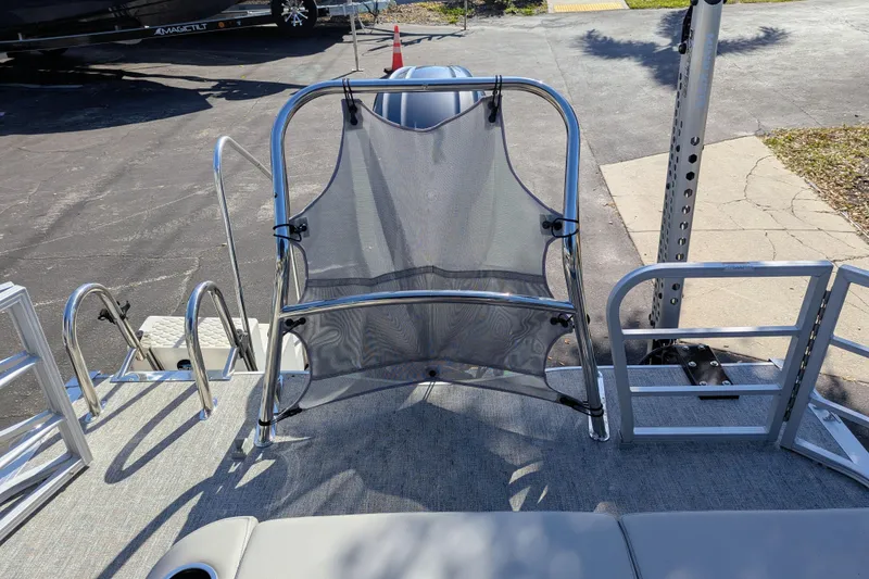 Slide: The Image of 2025 Trifecta 22UL LE T boat interior with open storage compartment. - 21