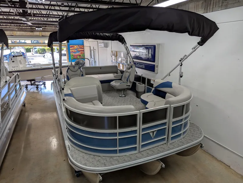 Slide: The Image of 2025 Trifecta 22UL LE T pontoon boat with Yamaha engine, deep discount sign visible. - 5