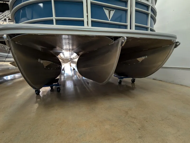Slide: The Image of 2025 Trifecta 22UL LE T pontoon boat with Yamaha outboard motor in showroom. - 7