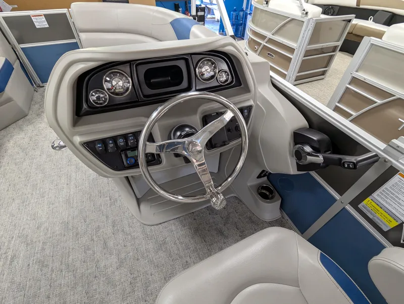 Slide: The Image of 2025 Trifecta 22UL LE T pontoon boat with Yamaha outboard motor in showroom. - 8