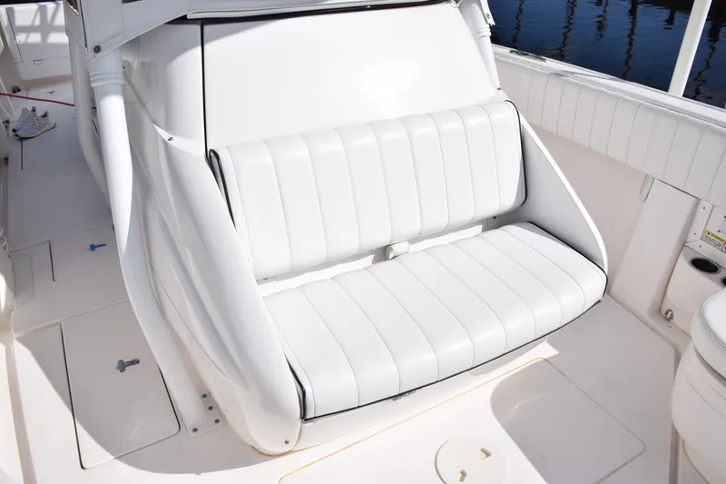 Slide: The Image of 2017 Intrepid 327 boat with white cushioned seating. - 13