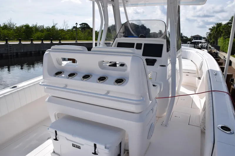 Slide: The Image of 2017 Intrepid 327 boat interior with helm and seating area. - 28