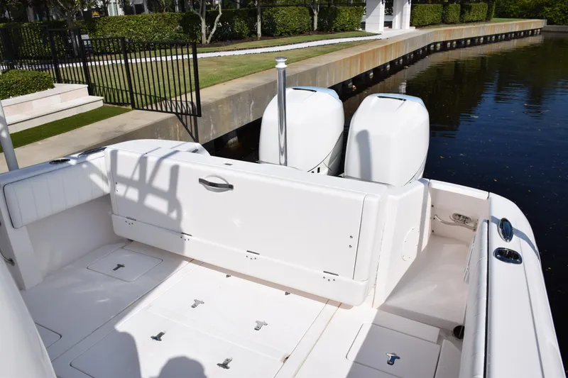 Slide: The Image of 2017 Intrepid 327 boat with dual engines docked by a canal. - 39