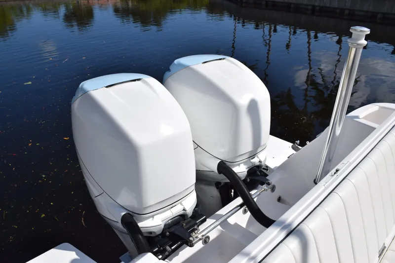 Slide: The Image of 2017 Intrepid 327 boat with dual outboard engines on calm water. - 47