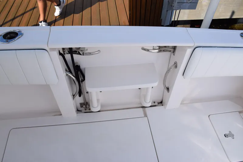 Slide: The Image of 2017 Intrepid 327 boat deck with seating and storage compartments. - 49