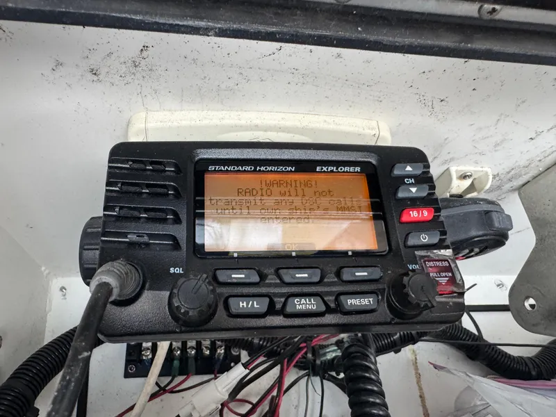 Slide: The Image of Standard Horizon Explorer marine radio on 2003 Triton 2690 CC boat dashboard. - 28