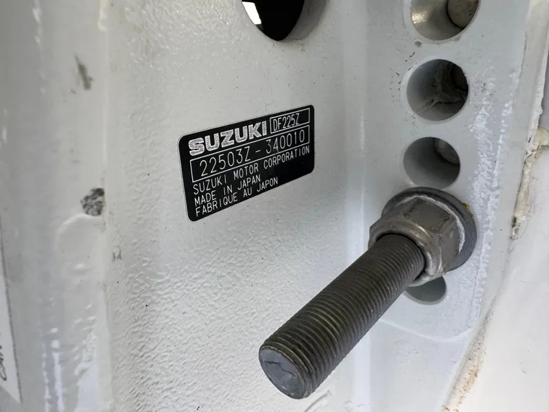 Slide: The Image of Suzuki motor label on Triton 2690 CC, 2003 model, showing serial number and manufacturing details. - 42