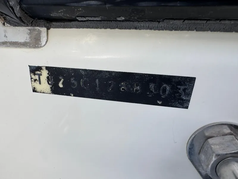Slide: The Image of Serial number plate on a 2003 Triton 2690 CC boat. - 43